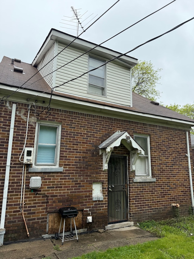 view of front of home with brick siding