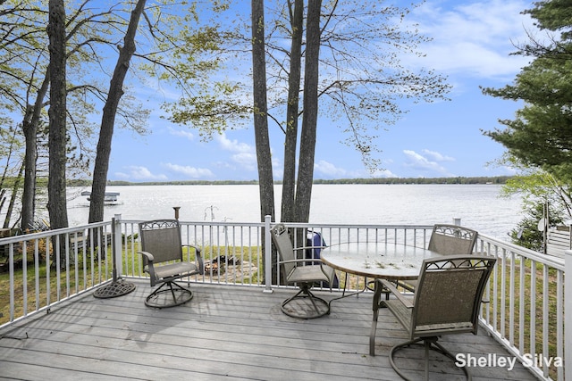 2496 Wolf Lake Dr, Baldwin, MI 49304 - wooden deck with a water view