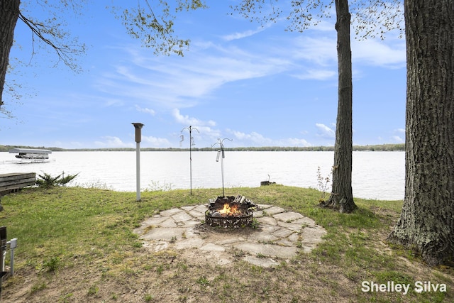 2496 Wolf Lake Dr, Baldwin, MI 49304 - water view featuring an outdoor fire pit