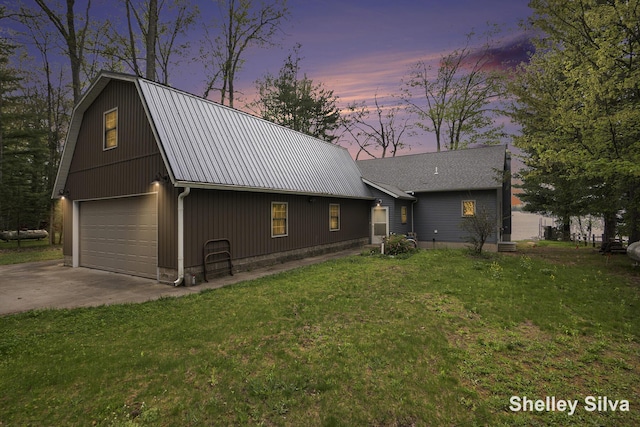 2496 Wolf Lake Dr, Baldwin, MI 49304 - view of front facade with metal roof, a gambrel roof, a front yard, and a garage