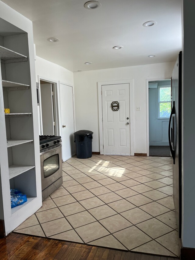 5606 Harold St, Hamtramck, MI 48212 - kitchen featuring stainless steel range with gas stovetop, light tile patterned floors, and recessed lighting