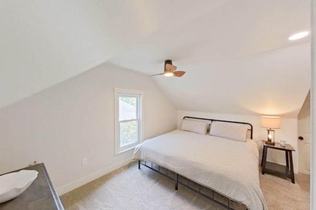 bedroom featuring vaulted ceiling, carpet, a ceiling fan, and baseboards