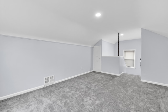 additional living space featuring lofted ceiling, carpet, baseboards, and recessed lighting