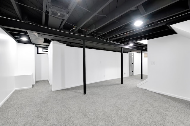 basement with carpet and baseboards