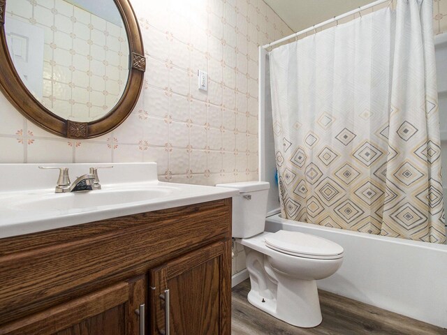 405 Jean St, Sturgis, MI 49091 - bathroom featuring wood finished floors, vanity, toilet, and shower / bath combo