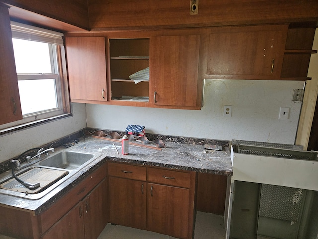 5297 Vancouver St, Detroit, MI 48204 - kitchen with open shelves, a sink, and brown cabinets