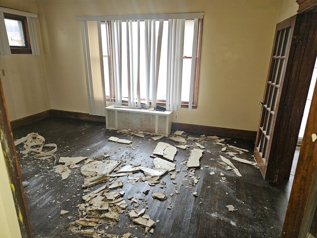 5297 Vancouver St, Detroit, MI 48204 - spare room with baseboards, wood finished floors, and radiator