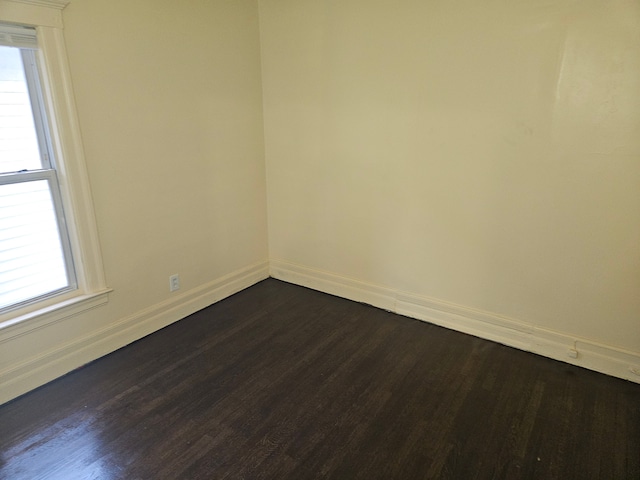 5297 Vancouver St, Detroit, MI 48204 - unfurnished room featuring dark wood-style flooring, baseboards, and plenty of natural light