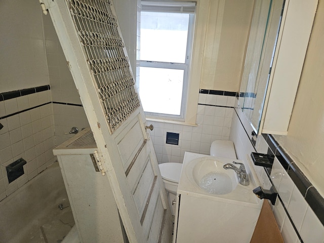 5297 Vancouver St, Detroit, MI 48204 - bathroom with vanity, toilet, tile walls, and a wainscoted wall