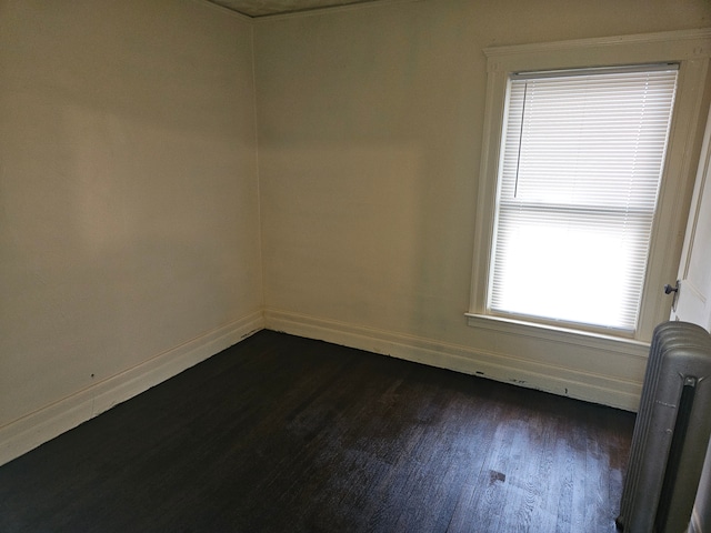 5297 Vancouver St, Detroit, MI 48204 - unfurnished room featuring dark wood-style flooring and baseboards