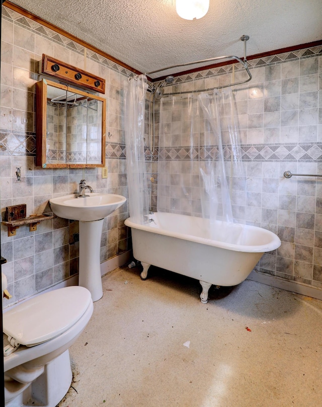 156 W 19th St, Holland, MI 49423 - bathroom with tile walls, shower / bath combination with curtain, a textured ceiling, and toilet