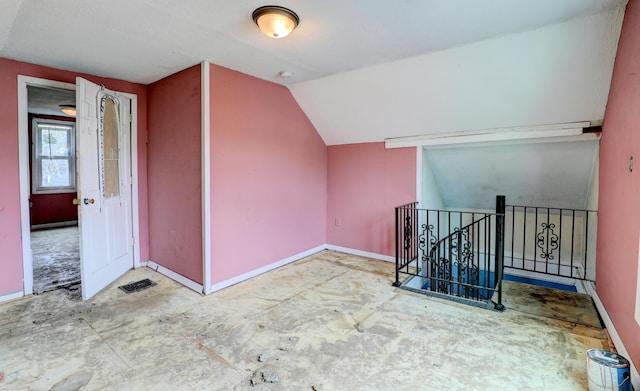156 W 19th St, Holland, MI 49423 - bonus room featuring baseboards and vaulted ceiling