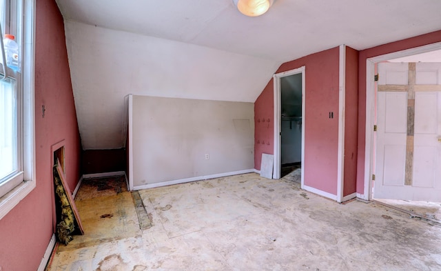 156 W 19th St, Holland, MI 49423 - additional living space featuring baseboards and vaulted ceiling