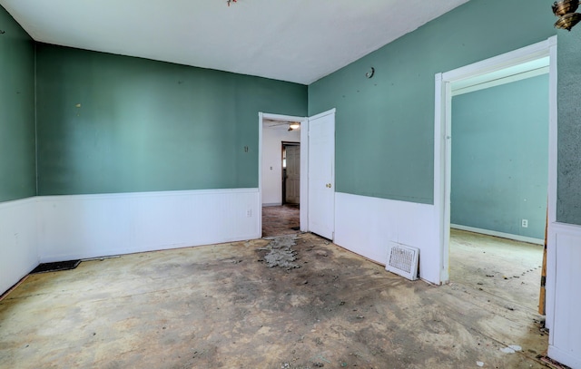 156 W 19th St, Holland, MI 49423 - unfurnished room with unfinished concrete floors and ceiling fan