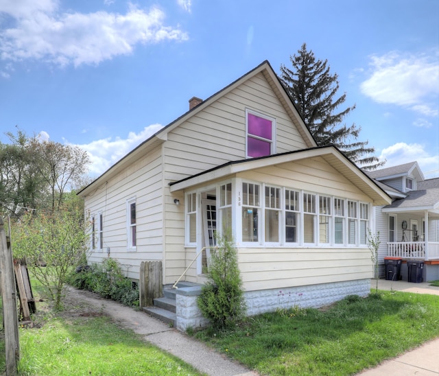 156 W 19th St, Holland, MI 49423 - view of front of house with a chimney