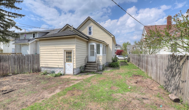 156 W 19th St, Holland, MI 49423 - back of property featuring entry steps and a fenced backyard