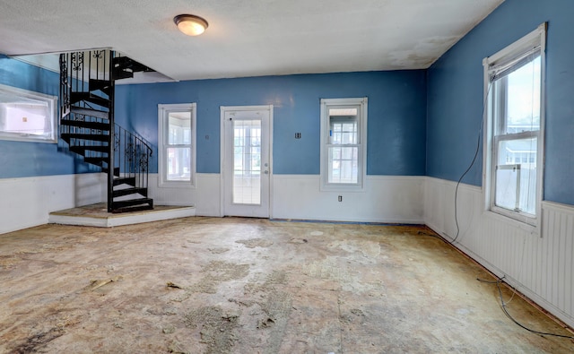 156 W 19th St, Holland, MI 49423 - foyer entrance featuring stairs and a wainscoted wall