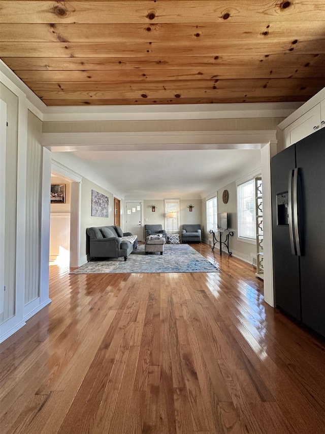 12061 Emelia St, Birch Run, MI 48415 - living area with wood finished floors, wooden ceiling, and baseboards