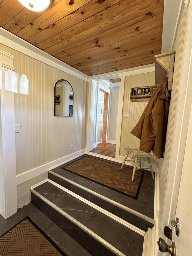 12061 Emelia St, Birch Run, MI 48415 - stairway with wooden ceiling, baseboards, and wooden walls