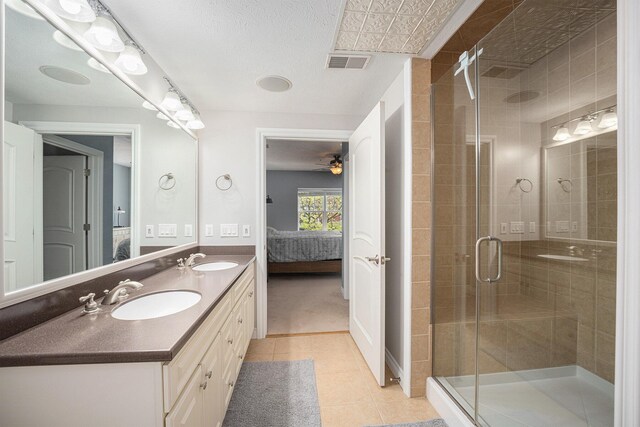 327 State St # 2, Saint Joseph, MI 49085 - ensuite bathroom with tile patterned flooring, a stall shower, double vanity, and a ceiling fan