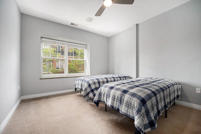 327 State St # 2, Saint Joseph, MI 49085 - bedroom with carpet floors, baseboards, and ceiling fan