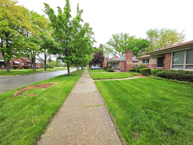 19266 Tyrone St, Harper Woods, MI 48225 - view of asphalt road with sidewalks