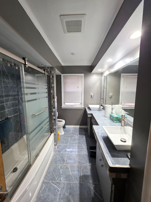 19266 Tyrone St, Harper Woods, MI 48225 - bathroom with toilet, ornamental molding, double vanity, baseboards, and shower / bath combination with glass door