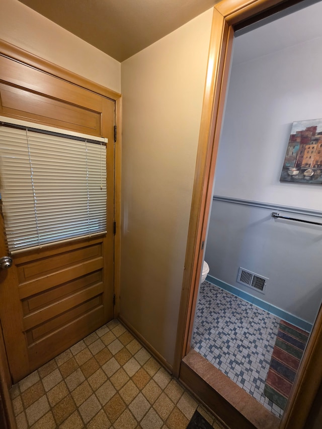 19266 Tyrone St, Harper Woods, MI 48225 - bathroom with baseboards, toilet, and tile patterned floors