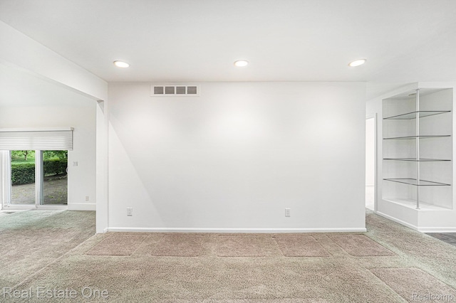 3079 Ravinewood Dr, Commerce Twp, MI 48382 - carpeted empty room with baseboards and recessed lighting