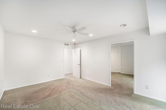 3079 Ravinewood Dr, Commerce Twp, MI 48382 - unfurnished bedroom with carpet flooring, recessed lighting, baseboards, a ceiling fan, and a closet