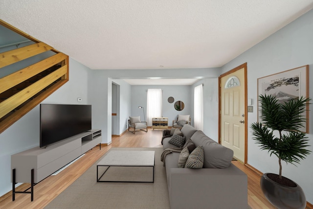 5732 Selfridge Blvd, Lansing, MI 48911 - living area with wood finished floors and a textured ceiling