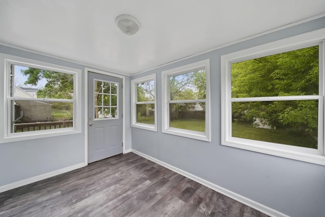 5732 Selfridge Blvd, Lansing, MI 48911 - unfurnished sunroom featuring baseboards, plenty of natural light, and wood finished floors