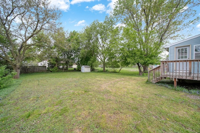 5732 Selfridge Blvd, Lansing, MI 48911 - view of yard featuring a storage unit, a wooden deck, and an outbuilding