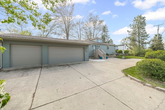 9417 Cedar Island Rd, White Lake, MI 48386 - view of front of home featuring a garage