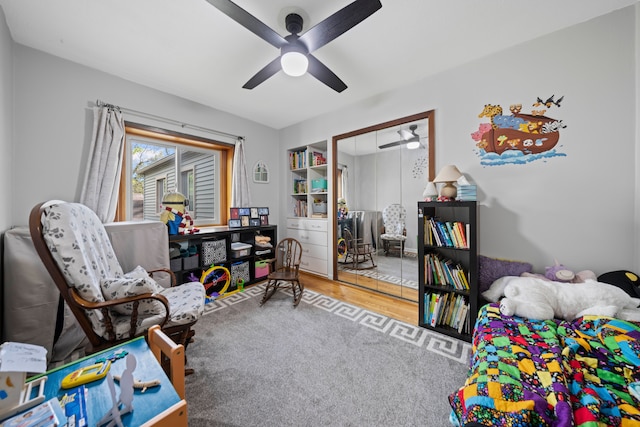 9417 Cedar Island Rd, White Lake, MI 48386 - sitting room with a ceiling fan and wood finished floors