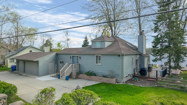 9417 Cedar Island Rd, White Lake, MI 48386 - back of house with a chimney and roof with shingles