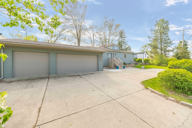 9417 Cedar Island Rd, White Lake, MI 48386 - view of front of house with a garage