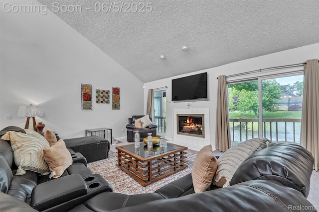 5520 Ridgewood, West Bloomfield, MI 48322 - carpeted living area with a textured ceiling, high vaulted ceiling, a fireplace, and baseboards