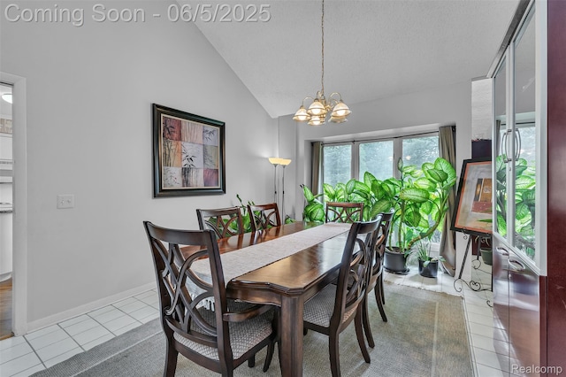 5520 Ridgewood, West Bloomfield, MI 48322 - dining space with a chandelier, tile patterned floors, vaulted ceiling, baseboards, and a textured ceiling