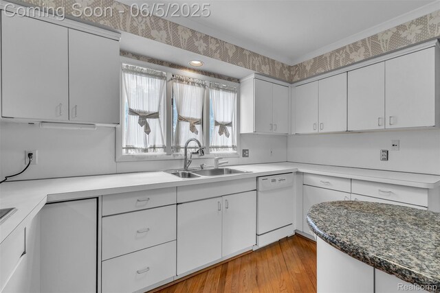 5520 Ridgewood, West Bloomfield, MI 48322 - kitchen with dishwasher, a sink, white cabinetry, and light wood-type flooring
