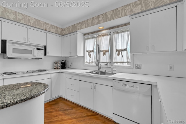 5520 Ridgewood, West Bloomfield, MI 48322 - kitchen with white appliances, a sink, white cabinets, and light wood-style flooring