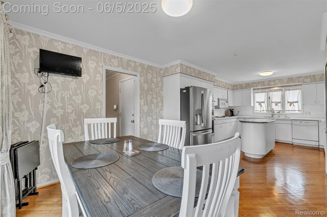 5520 Ridgewood, West Bloomfield, MI 48322 - dining space featuring wallpapered walls, crown molding, and light wood finished floors