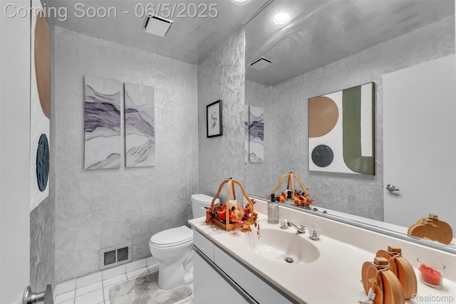 5520 Ridgewood, West Bloomfield, MI 48322 - bathroom featuring vanity, toilet, and tile patterned floors