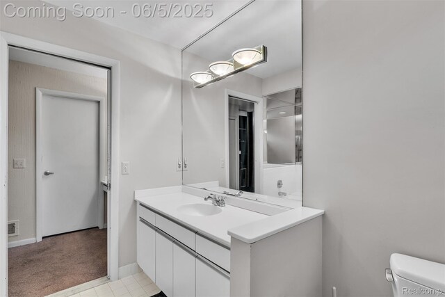 5520 Ridgewood, West Bloomfield, MI 48322 - bathroom featuring vanity, toilet, and baseboards