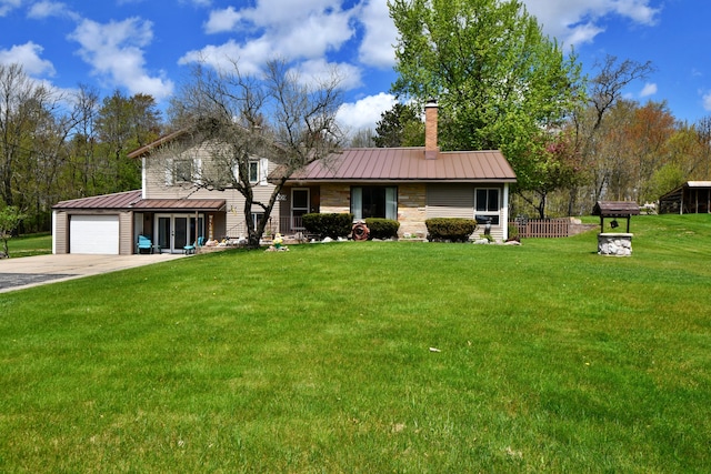 9609 E Madison Rd, Saint Helen, MI 48656 - view of front of property featuring a standing seam roof, metal roof, an attached garage, and a chimney