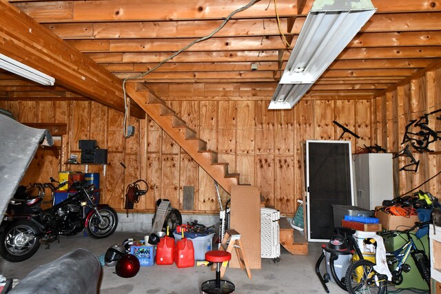 9609 E Madison Rd, Saint Helen, MI 48656 - garage with wood walls