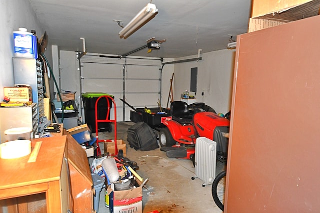 9609 E Madison Rd, Saint Helen, MI 48656 - garage featuring a garage door opener