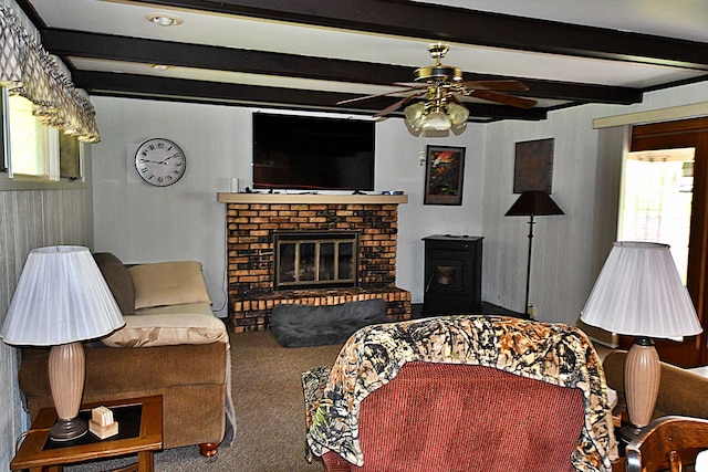9609 E Madison Rd, Saint Helen, MI 48656 - carpeted living area with beam ceiling, ceiling fan, and a brick fireplace