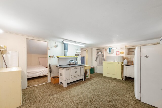155 N Cook Ave, Harrison, MI 48625 - bedroom featuring freestanding refrigerator and carpet floors