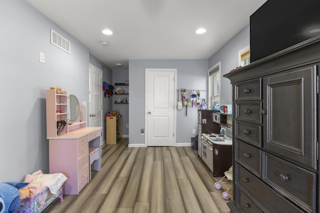 22171 Monterey Dr, Trenton, MI 48183 - bedroom featuring light wood-style flooring, baseboards, and recessed lighting